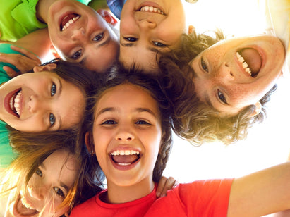 children in brightly coloured t-shirts