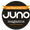 Placa circular naranja y marrón oscuro que indica que la loción autobronceadora de 150 ml apareció en la revista Juno.